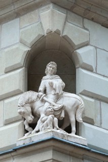 Sculpture of St. Martin on a house corner