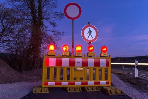 Illuminated road block on bicycle path