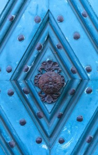 Historical doorknob on a blue front door