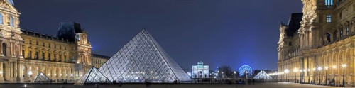 Illuminated Louvre with glass pyramid
