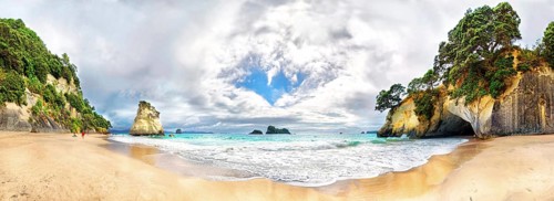 Cathedral Cove Beach with detached calcareous sandstone rocks and cave entrance of the Cathedral Cave