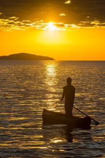 Fisherman in his canoe on Lake Malawi