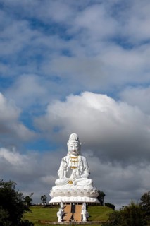 Giant Guan Yin statue sitting on lotus flower
