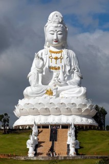 Giant Guan Yin statue sitting on lotus flower
