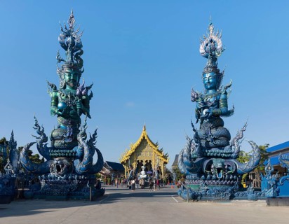 Demons sculptures at the entrance of Wat Rong Seur Ten