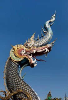 Richly decorated Naga at the entrance of Wat Rong Seur Ten