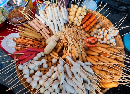 Various skewers with sausage and meat