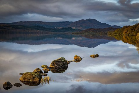 Reflection in Loch Katrine with Highlands