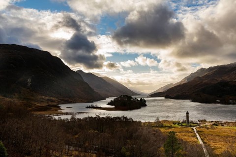 Loch Shiel with Glenfinnan Monument under cloudy sky