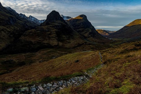 Hiking trail in mountain scenery with peaks of Stob Coire nan Lochan