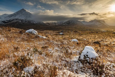 Snowy mountain tops of Ben Lee with clouds in Highland landscape