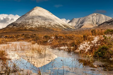 Moor landscape with snow-covered peaks of the Cullins Mountains in Highland Landscape