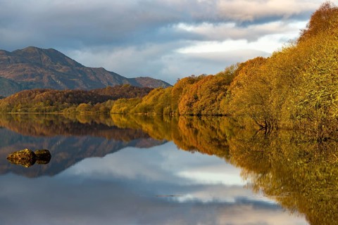 Reflection in Loch Katrine with Highlands