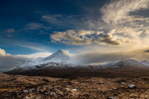Snowy mountain tops of Ben Lee with clouds in Highland landscape