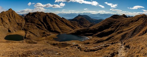 Small and medium Seefeldsee lake with autumnal mountains in the background