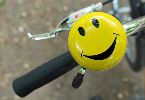 Bicycle handlebars with bell with laughing smiley