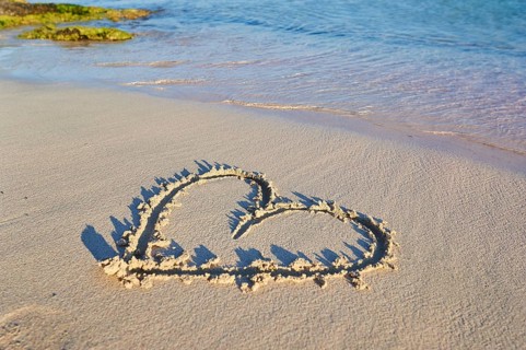 Heart paintet in sand