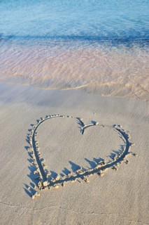 Heart paintet in sand
