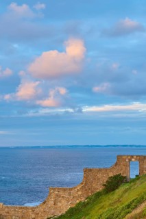 Door trough a wall to the beach of the atlantic ocean at Hondarribia