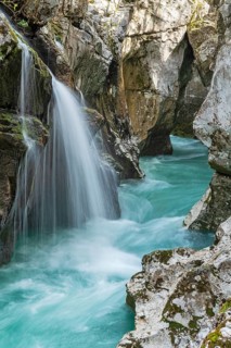 Waterfall on the emerald green wild river Soca