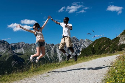 Couple jumping joyfully in the air