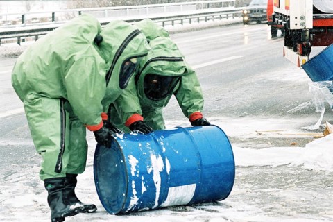 Firefighters wearing chemical protection suits