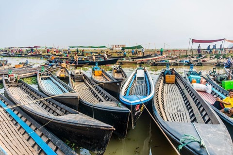 Many wooden boats at dock in the harbor