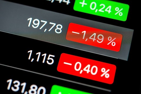 Close up of rising and falling stock prices on smartphone screen