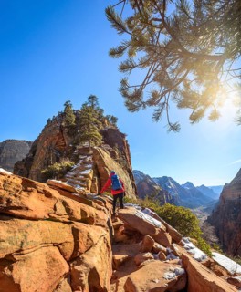 Young woman hiking on the via ferrata to Angels Landing