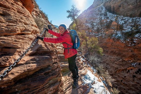Young woman hiking on the via ferrata of the Angels Landing Trail