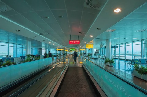 Moving walkway and signs at the airport