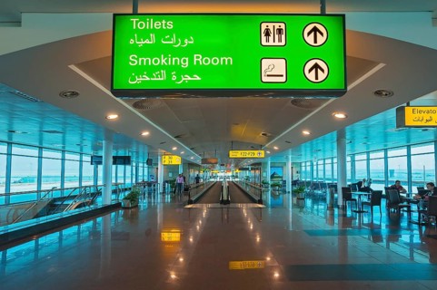Moving walkway and signs at the airport
