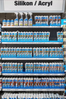 Shelves with silicone and acrylic in hardware store