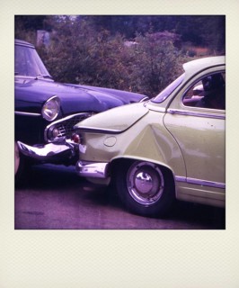 Old Polaroid photograph of crash vintage cars