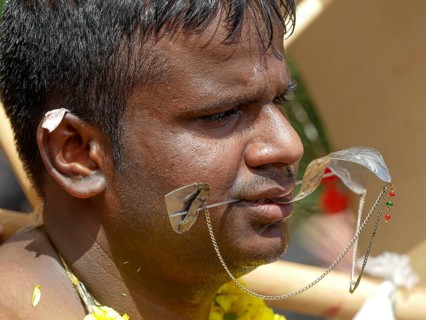 Kavadi dancers with pierced cheeks