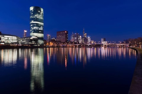 Skyline of Frankfurt from the banks of the Main with the Westhafen Tower