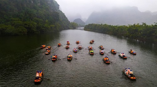 Rowing boats with tourists on river