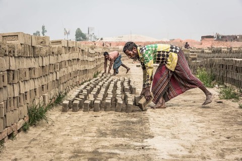 Brick factory worker Stacks dried bricks