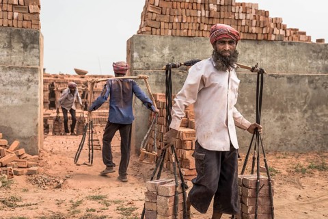 Brickworks worker transports bricks