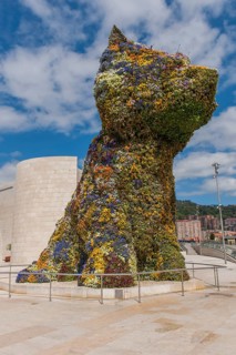Sculpture Puppy by Jeff Koons in front Guggenheim Museum Bilbao
