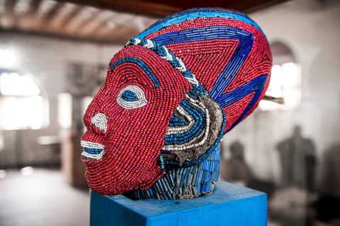Sculpture decorated with glass and ceramic beads