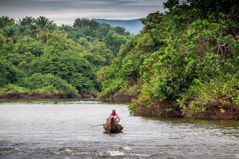 Man in dugout canoe
