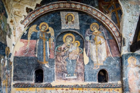 Frescoes with traces of vandalism
