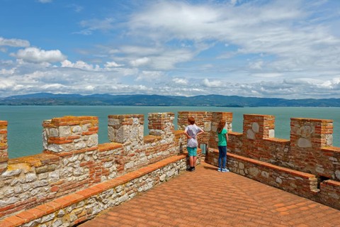 Two children stand on battlements