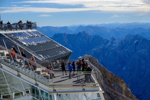 Hikers on the viewing platform of the Bavarian Zugspitzbahn mountain station