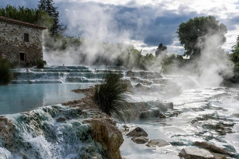 Steam is arising from the hot springs of Saturnia Therme in the morning