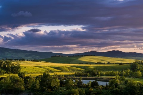 Typical green Tuscan landscape in Val d'Orcia with hills