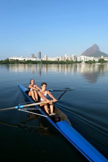 Two young women participating in early morning rowing training in the Lagoa Rodrigo de Freitas Lagoon
