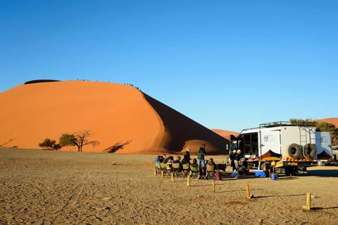 Dune 45 with safari tourists at Namib-Naukluft National Park in the Namib Desert