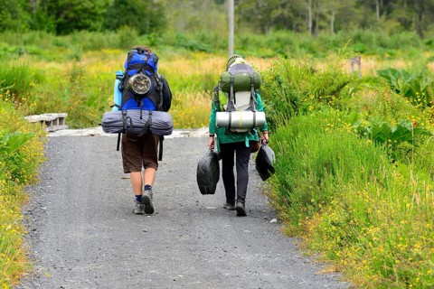 Tourists hiking with loaded backpacks
